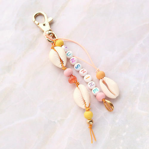 Sieraden met een strandthema van houten kralen, DQ metaal en schelpen
