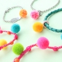 Heerlijke zomerse pompom bedels in de leukste kleuren