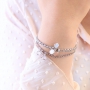 Oorbellen en armbandjes met hangers van crystal glas