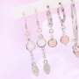 Oorbellen en armbandjes met hangers van crystal glas