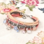 Oorbellen en armbandjes met hangers van crystal glas