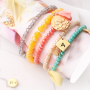 Snelle facetarmbandjes met bedeltjes en kwastjes