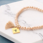 Snelle facetarmbandjes met bedeltjes en kwastjes