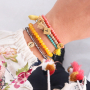 Snelle facetarmbandjes met bedeltjes en kwastjes
