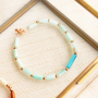 Deze sieraden kun je maken met de tube schelp kralen: 