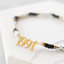 Deze sieraden maak je met de nieuwste stainless steel jaartal tussenstukken: