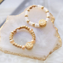 Ontwerp classy sieraden met yin-yang bedels en smiley kralen 