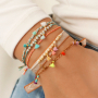 Verwerk de mini kwastjes in vrolijke sieraden